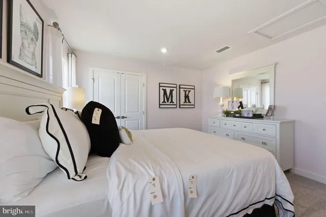 a bedroom with a bed and a cabinets