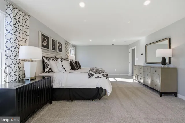 a bed room with a bed and a chair