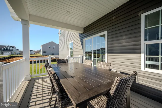 a view of a balcony with furniture