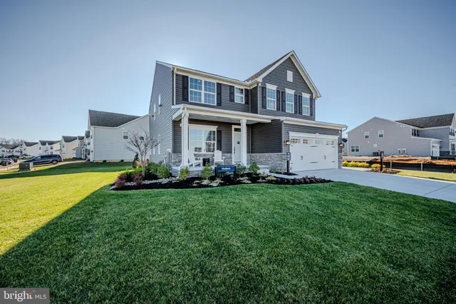 a front view of house with yard and swimming pool