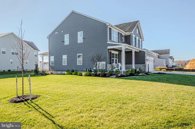 a front view of house with yard and seating area