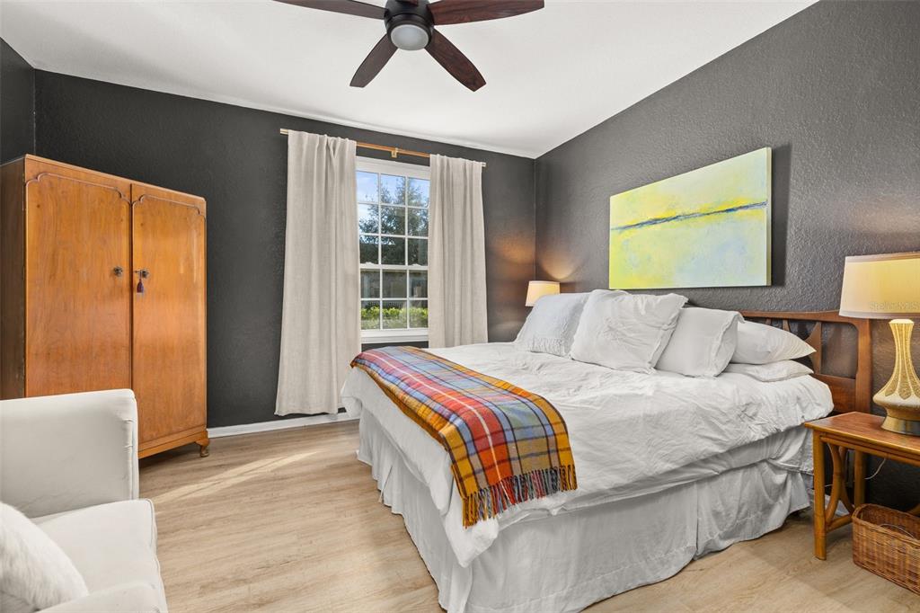 215 Longview Avenue, Unit 104 Celebration, FL 34747 - Photo 14 of 22 a bedroom with bed and window