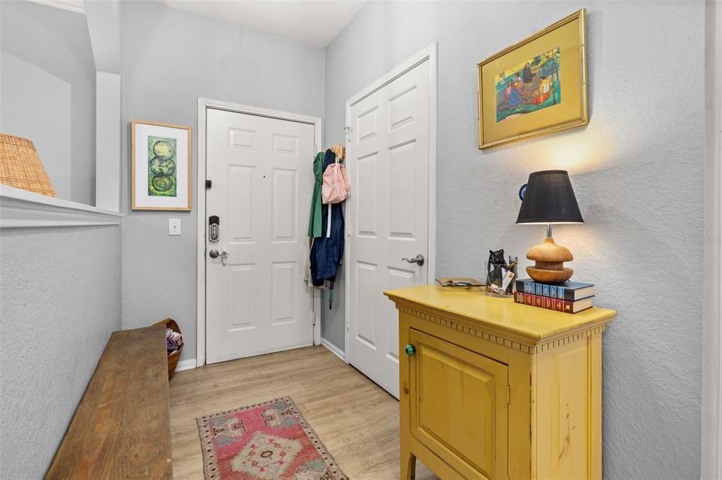 215 Longview Avenue, Unit 104 Celebration, FL 34747 - Photo 2 of 22 a bedroom with a bed and a dresser