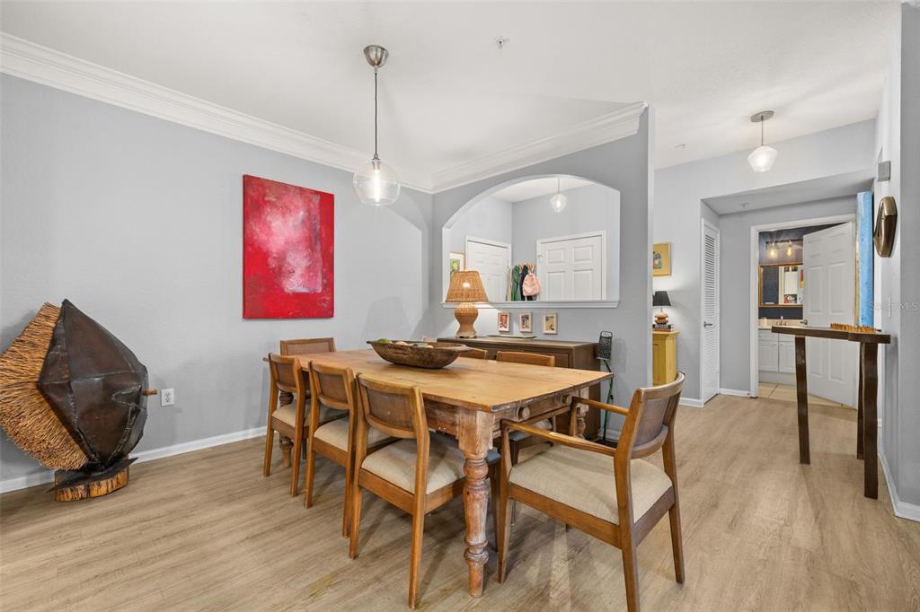 215 Longview Avenue, Unit 104 Celebration, FL 34747 - Photo 3 of 22 a view of a dining room with furniture