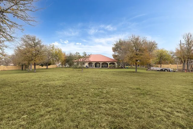a view of patio yard and ocean view