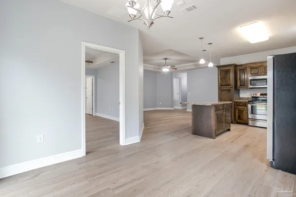 a view of kitchen with wooden floor