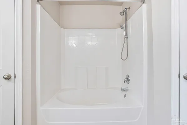 a close view of a bathtub in bathroom