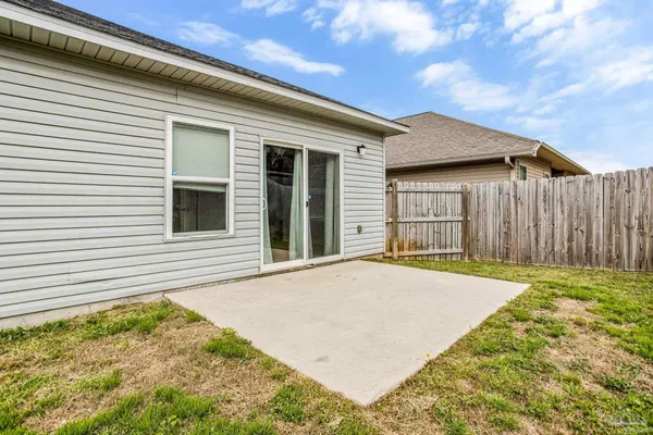 a view of a backyard of the house