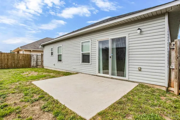 a view of a backyard with a garden and plants