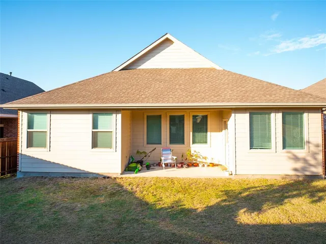 a front view of a house with a yard outdoor seating