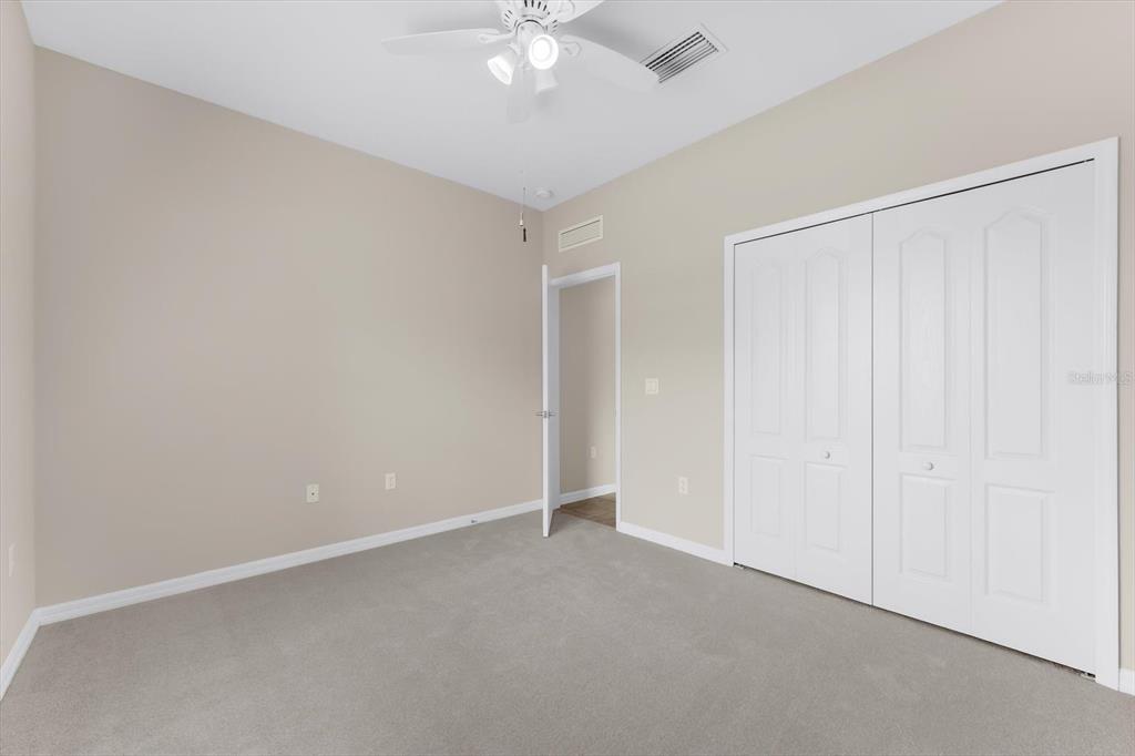 4326 Forest Creek Trail Parrish, FL 34219 - Photo 24 of 73 an empty room with a ceiling fan and a window