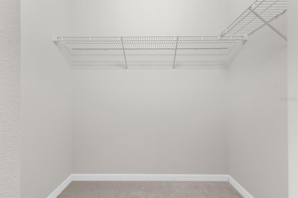 4326 Forest Creek Trail Parrish, FL 34219 - Photo 35 of 73 a view of a room with racks on the wall