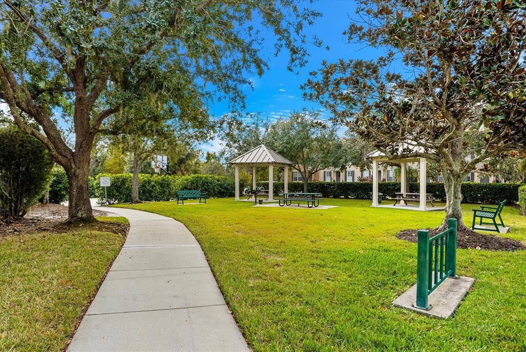 4326 Forest Creek Trail Parrish, FL 34219 - Photo 62 of 73 a view of a house with swimming pool and a yard