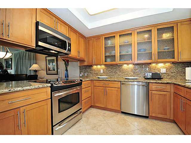 6385 Rancho Mission Road, Unit 3 San Diego, CA 92108 - Photo 6 of 18 Gutted and beautifully remodeled Kitchen has granite counters and back splash, stainless steel appliances, textured glass inserts.
