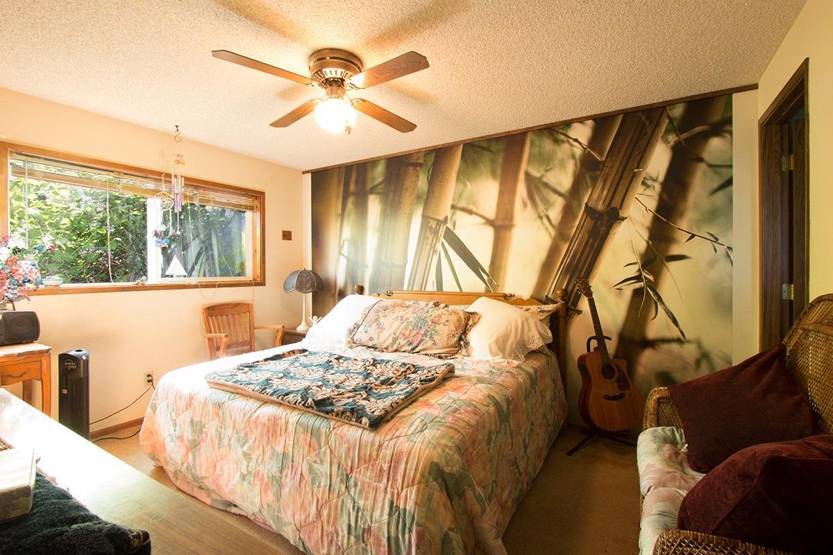 8288 Division Road White City, OR 97503 - Photo 10 of 15 a bedroom with a bed and a window