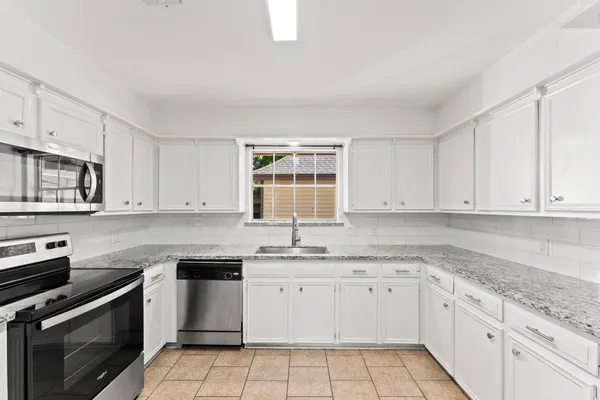 a view of a dining room with furniture and window
