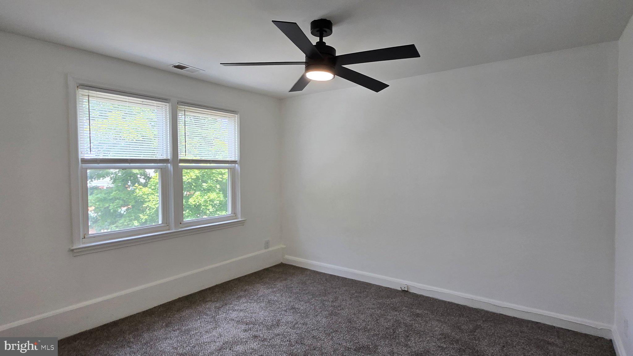 3820 Elkader Road Baltimore, MD 21218 - Photo 29 of 41 Bright and airy room with modern fan.