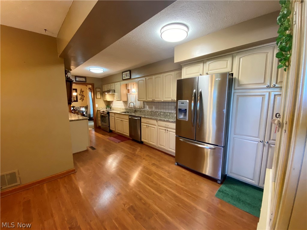 7898 Spieth Road Litchfield, OH 44253 - Photo 6 of 34 Updated kitchen. Kitchen appliances remain.