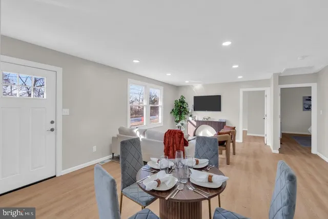 a view of a dining room with furniture window and wooden floor