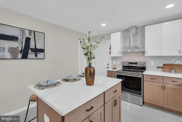 a kitchen with a sink a stove and cabinets