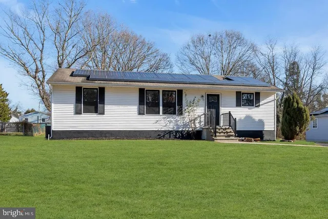 a front view of house with yard