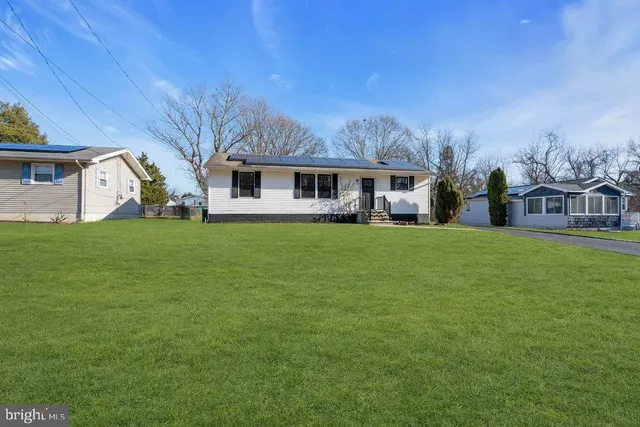 a view of a house with a big yard