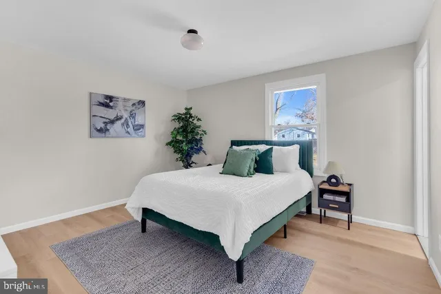 a bedroom with a bed and a table in it