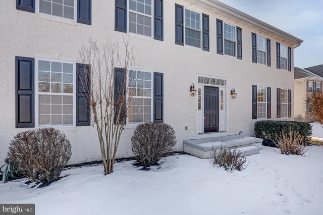 a view of covered with snow in front of house
