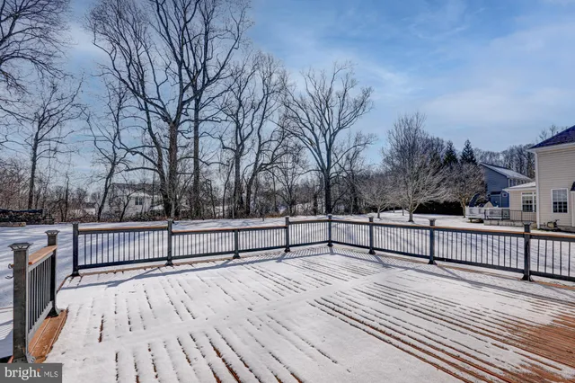 a view of a roof with wooden fence