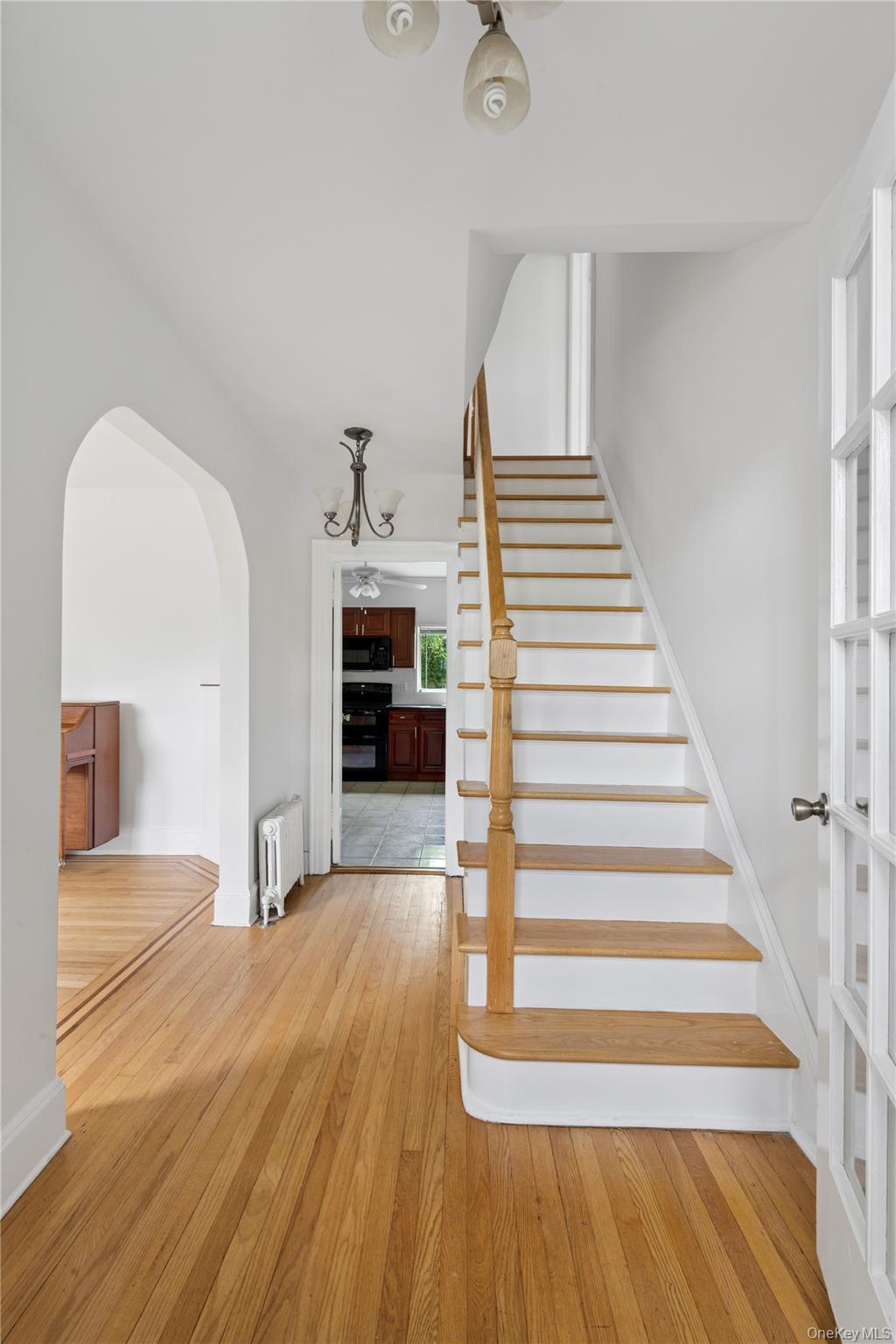 17 Old Orchard Road New Rochelle, NY 10804 - Photo 2 of 32 a view of a livingroom with wooden floor and staircase