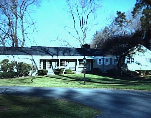 47 Manor Road Ridgefield, CT 06877 - Photo 1 of 1 a front view of a house with a yard