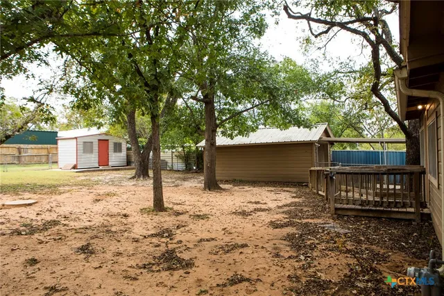 a house with trees in front of it