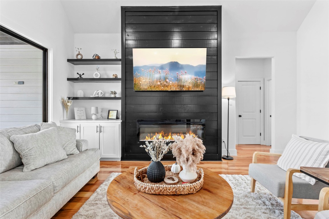 4346 Highway 21 Paige, TX 78659 - Photo 11 of 40 a living room with furniture and a fireplace