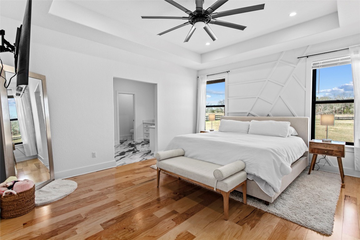 4346 Highway 21 Paige, TX 78659 - Photo 24 of 40 a bedroom with a bed and a flat screen tv