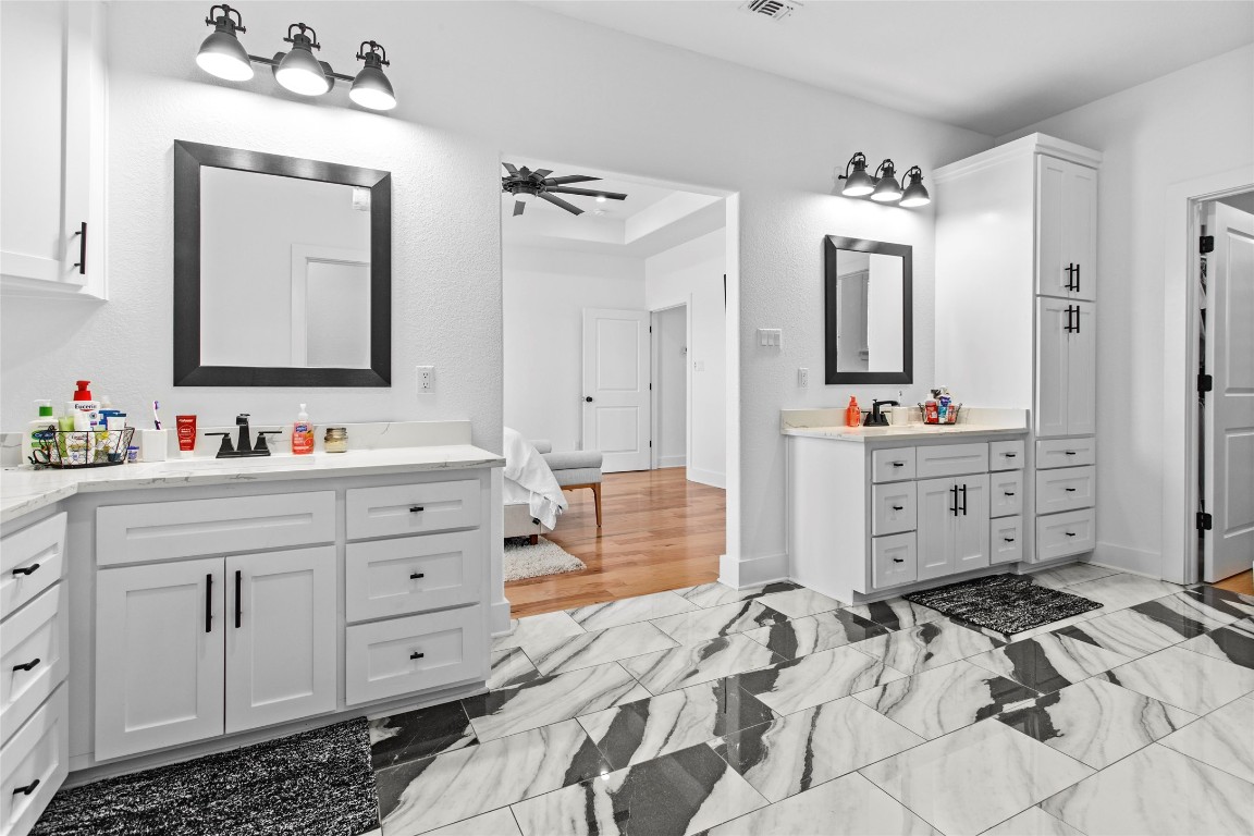 4346 Highway 21 Paige, TX 78659 - Photo 30 of 40 a bathroom with a double vanity sink mirror and