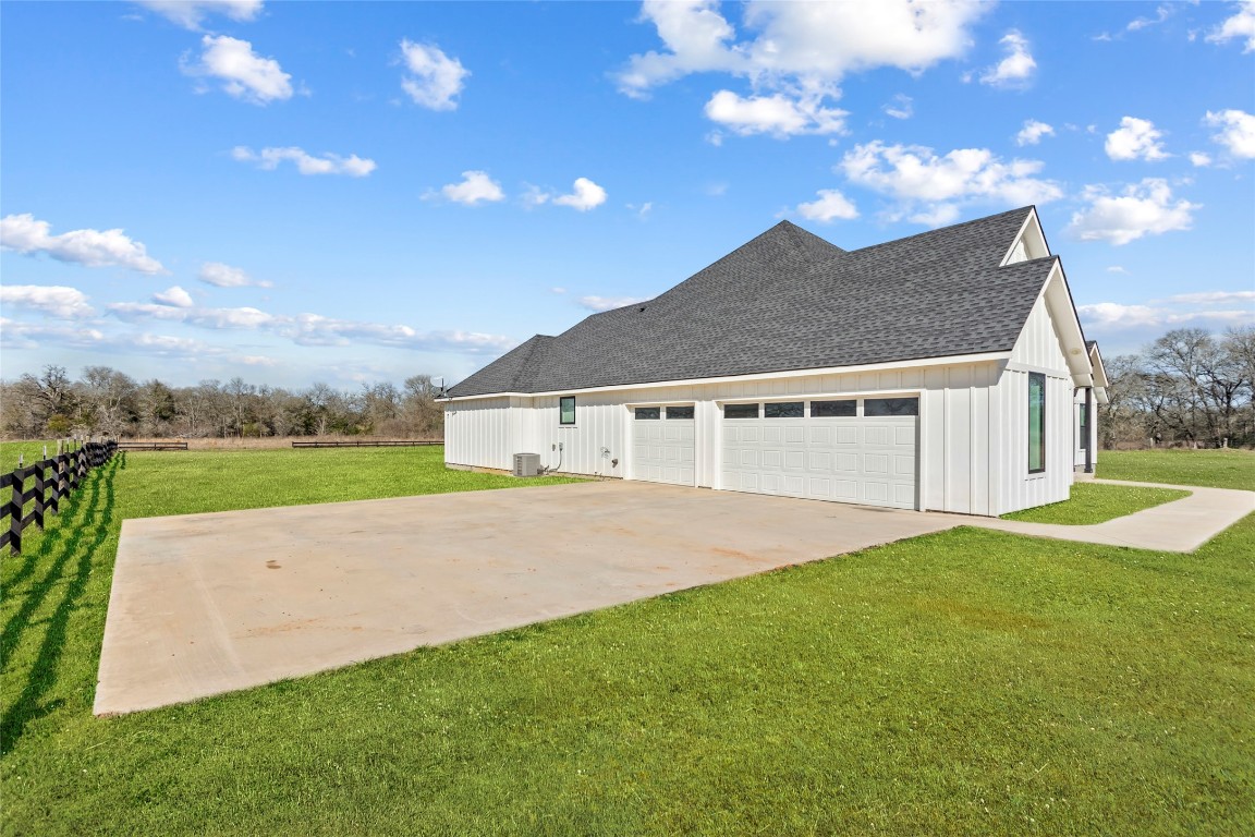 4346 Highway 21 Paige, TX 78659 - Photo 37 of 40 a house with green field in front of it