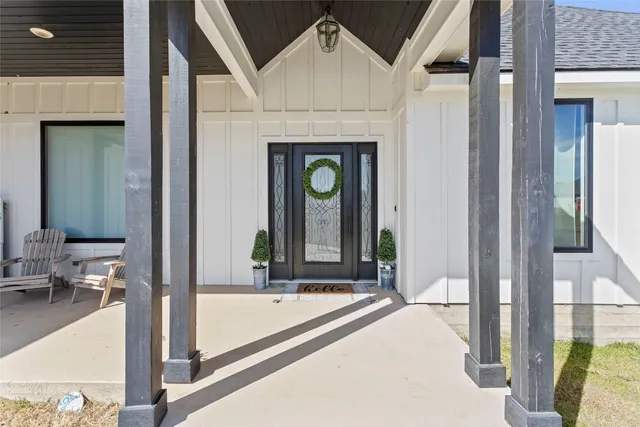 a front view of a house with outdoor seating