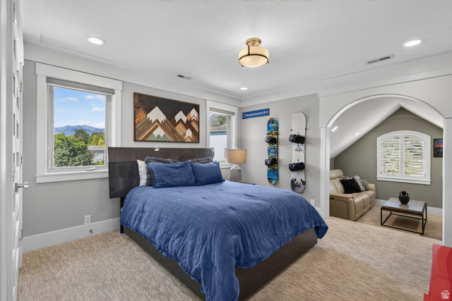 12308 Mariah Circle Draper, UT 84020 - Photo 86 of 293 Spacious room featuring carpeting, recessed lighting, and an arched entry to an additional alcove