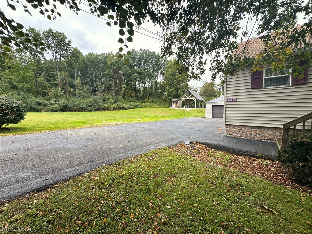 4421 State Road South Ashtabula, OH 44004 - Photo 1 of 18 Siding exterior with stone foundation and red window shutters