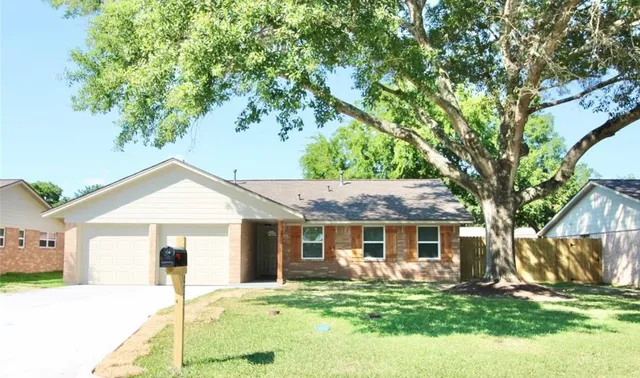 a front view of a house with a yard and porch