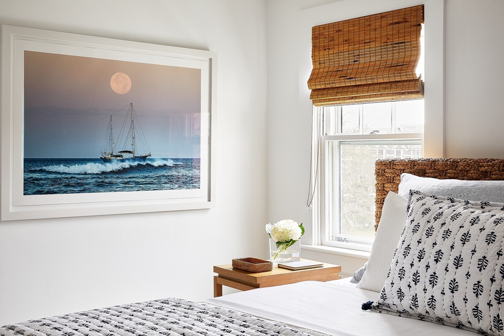 3 North Beach Street Nantucket, MA 02554 - Photo 7 of 13 a bedroom with a bed and wooden floor
