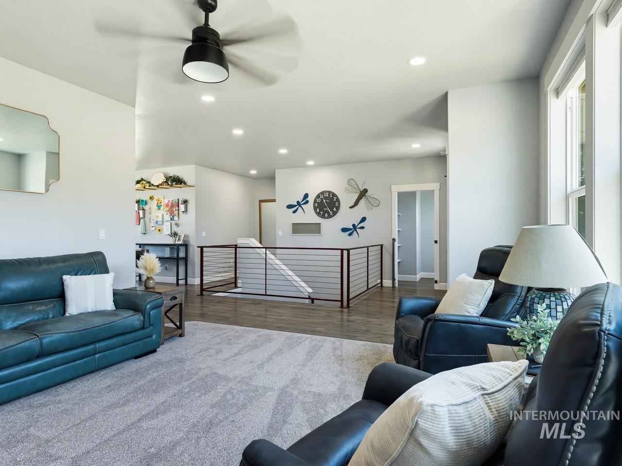 4950 West Columbia Road Nampa, ID 83687 - Photo 10 of 50 Open-concept living space featuring light gray walls and recessed lighting