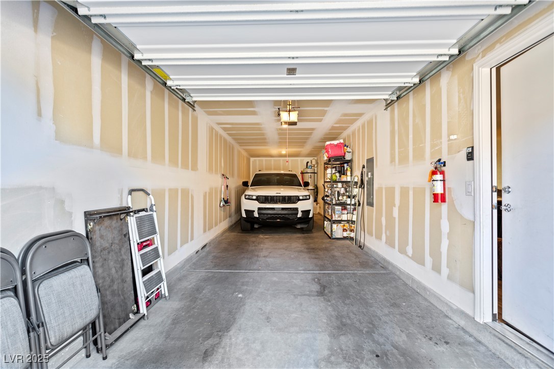 12280 Golden Wreath Road, Unit 3 Las Vegas, NV 89183 - Photo 34 of 57 Garage featuring electric panel and a garage door opener