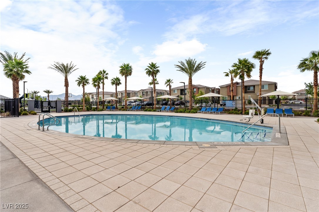 12280 Golden Wreath Road, Unit 3 Las Vegas, NV 89183 - Photo 43 of 57 Community pool featuring a residential view and a patio area