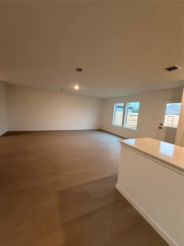 a view of an empty room and window