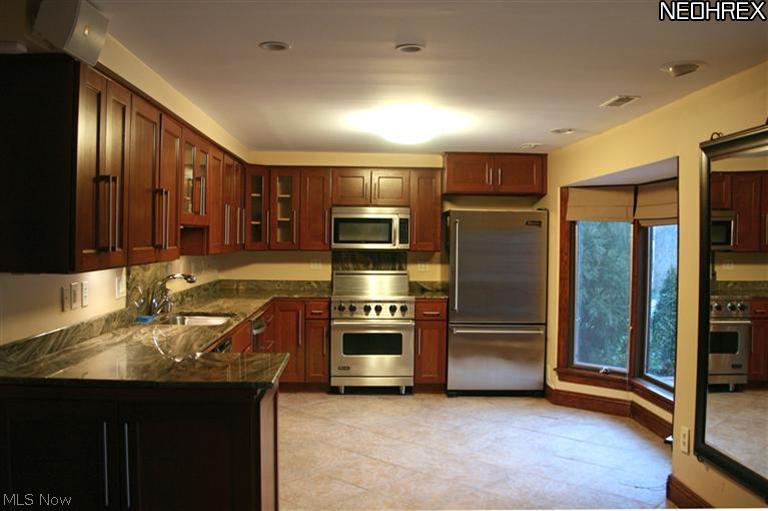 3535 Shade Road Akron, OH 44333 - Photo 6 of 25 The prep area of the Kitchen with custom cherry cabinets, granite counters, stainles appliancess and excellent work space