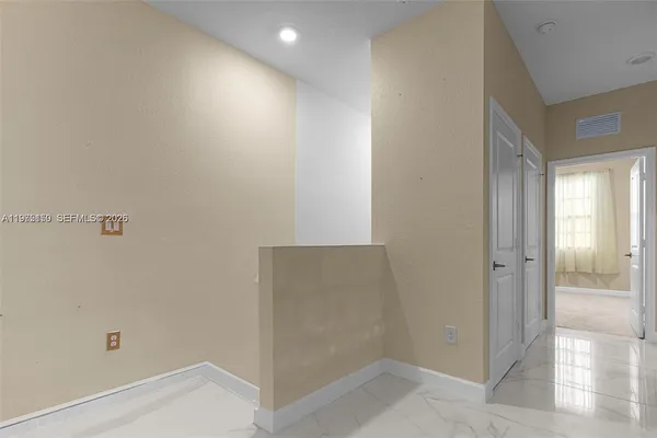 an empty room with closet area