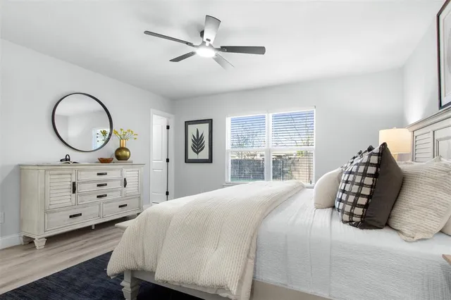 a bedroom with a bed and a dresser