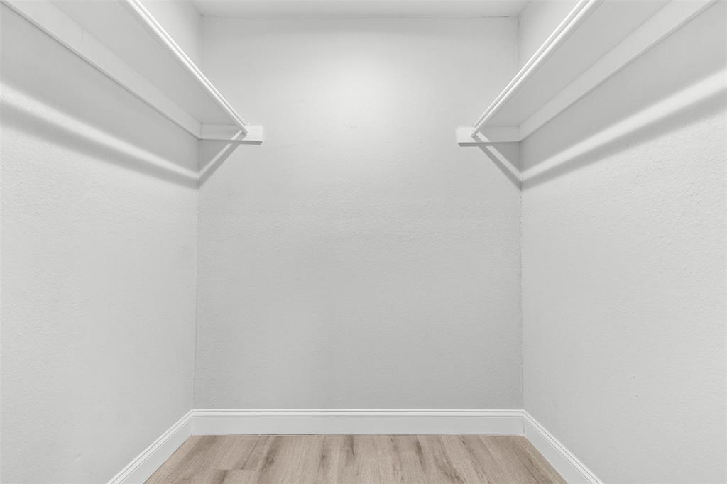 5405 Ramsey Drive The Colony, TX 75056 - Photo 22 of 32 a view of a room with racks on the wall