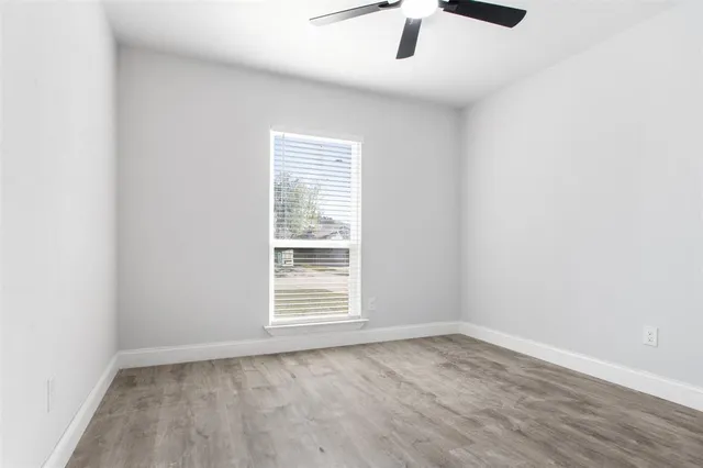 an empty room with a empty space and a window